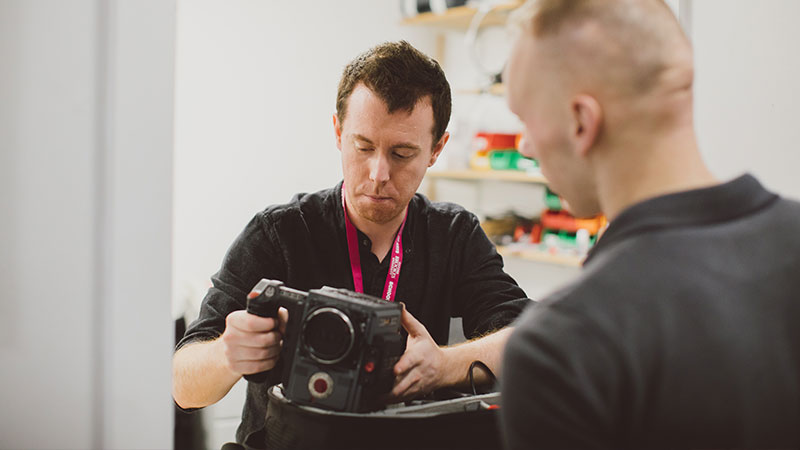 Student watching a tutor with a camera